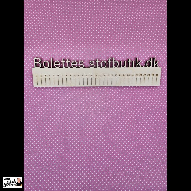 Fast bomuld med hvide prikker p pink baggrund